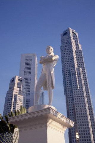 Skyscrapers tower beyond a statue of Sir Thomas Stamford Raffles (1781-1826), the British colonial administrator, in Raffles Place, Singapore